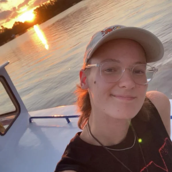 University College Roosevelt student smiling on a boat