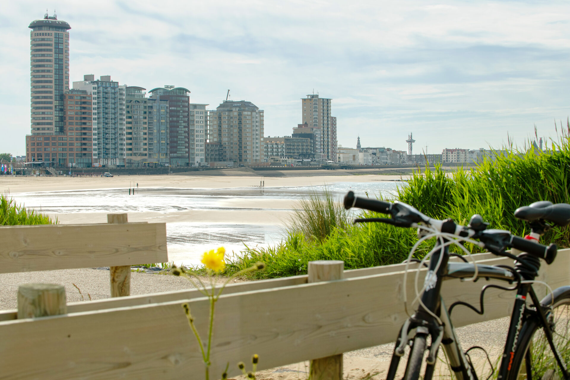 Vlissingen beach with the boulevard in the background and a bicycle in the foreground